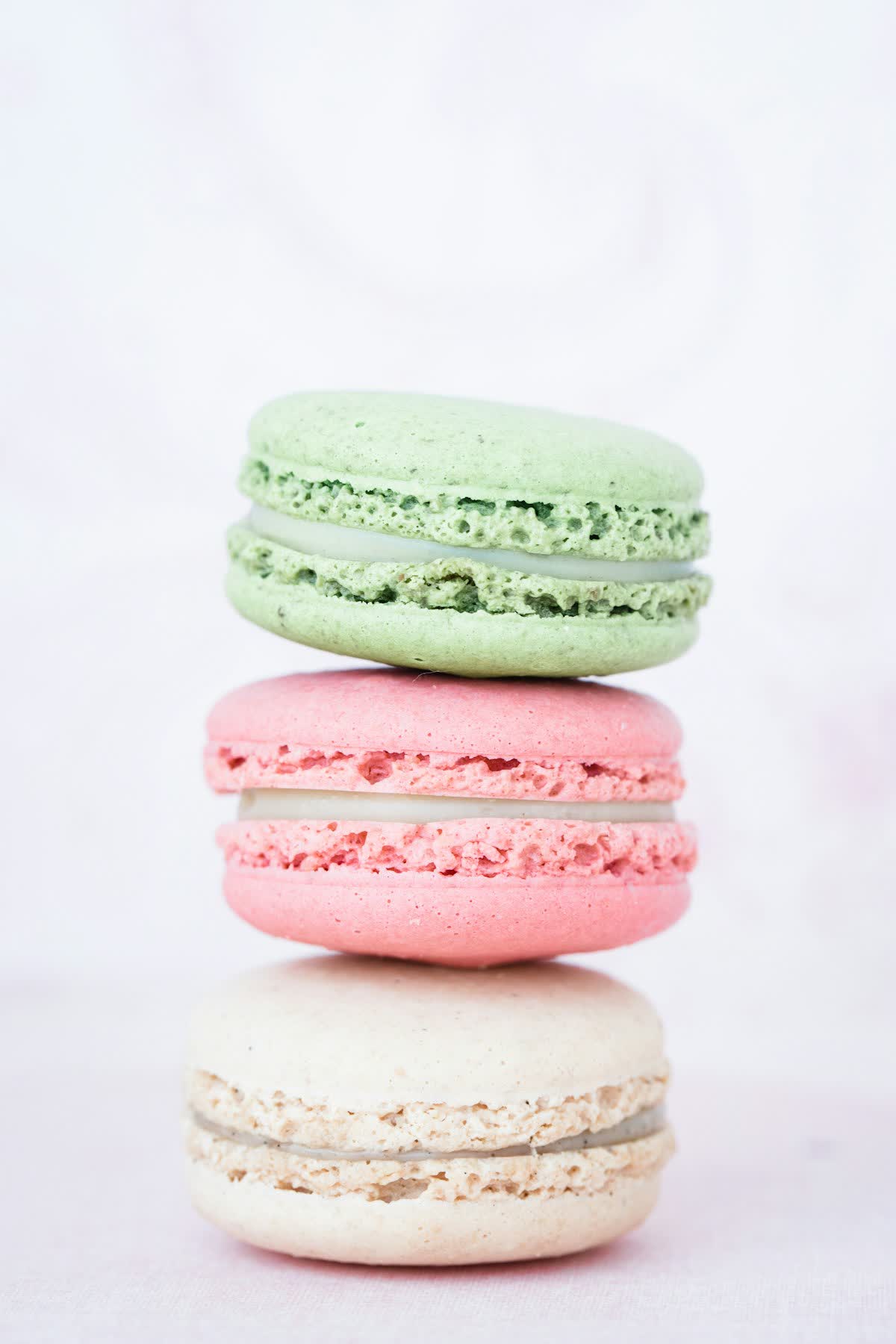 Stack of pistachio and rose macarons